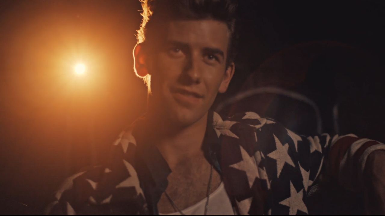 a man wearing a shirt covered in stars